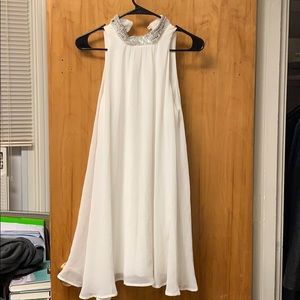 White high-neck dress with diamond detail